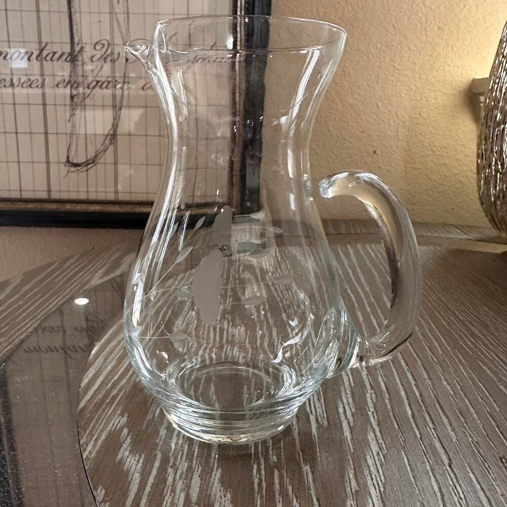 Clear glass pitcher with etched